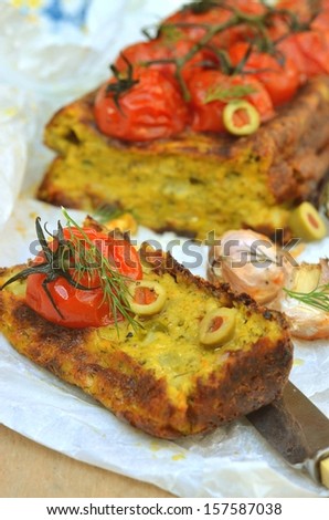 vegetable cake with spiced tomatoes
