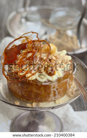 Pumpkin custard pie with a caramel decoration and pecan nuts
