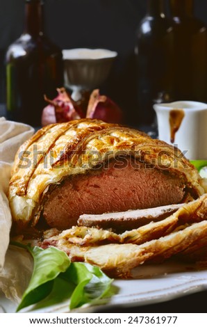 Beef Wellington on a white tray. selective focus