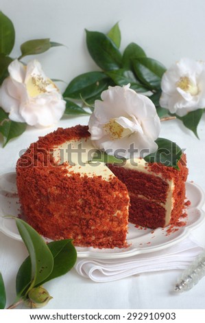 Red Velvet Cake on a Platter and on a White Wooden Background. Selective Focus
