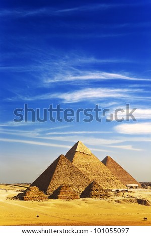 Egypt. Cairo-Giza. General view of pyramids from the Giza Plateau (there is three pyramids known as Queens\' Pyramids on front side; next in order from left: the Pyramid of Menkaure, Khafre and Chufu)