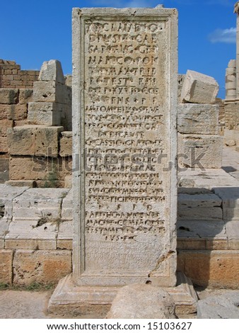 stock-photo-libya-leptis-magna-the-old-forum-inscription-in-latin-and-neo-punic-carved-on-limestone-plate-15103627.jpg