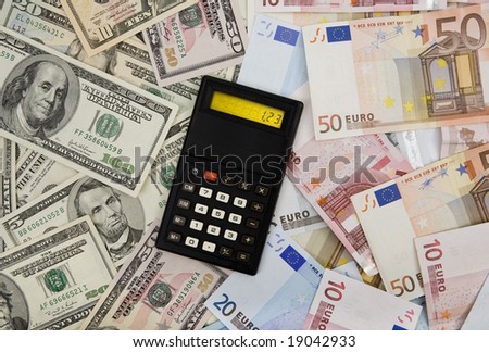 Dollar and euro banknotes background with calculator displaying exchange rate