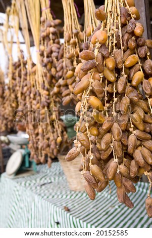 Stall with clusters of ripe date hanging down.