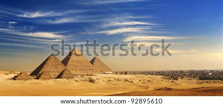 Egypt. Cairo - Giza. General view of pyramids and cityskape from the Giza Plateau (on front side: three pyramids known as Queens\' Pyramids; next: the Pyramid of Menkaure, Khafre and Chufu)