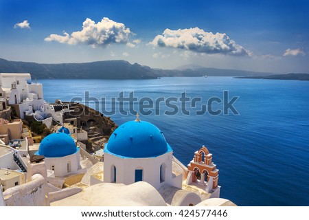 Greece. Cyclades Islands - Santorini (Thira). Oia town with typical Cycladic architecture - painted blue cupolas and white walls of houses. The Anastasis Church