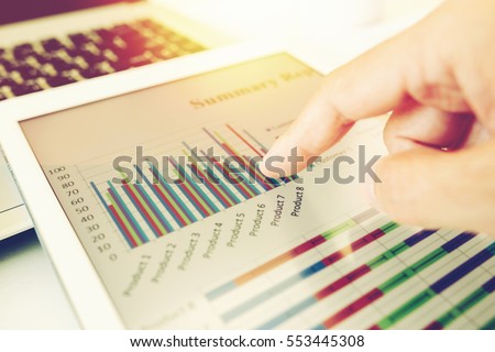 business woman investment consultant analyzing company annual financial report balance statement working with documents graphics. Concept picture of economy, market, office,money and tax.