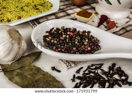 different spices, pepper, garlic, bay leaf, cloves
