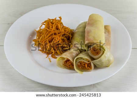 pickled cabbage leaves stuffed with spicy carrot