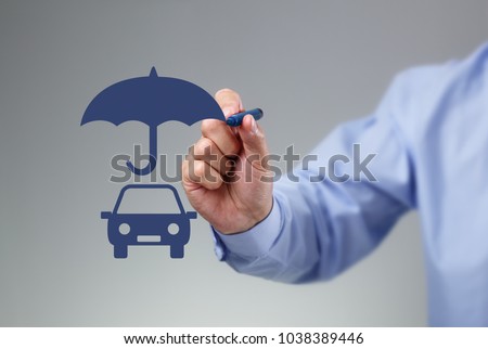 Businessman hand drawing an umbrella above a family car concept for car insurance, protection, security and finance
