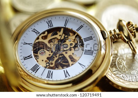 Pocket watch and gold coins concept for investment or time is money