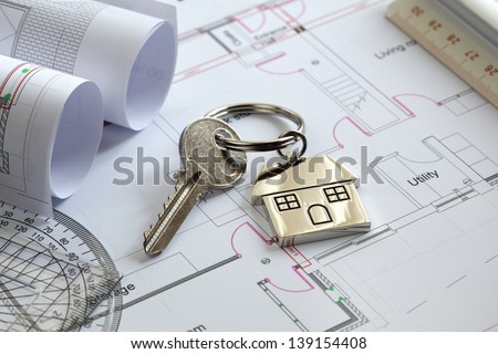 House Keys On A House Plan Blueprint Concept For New House Design Or Home Improvement