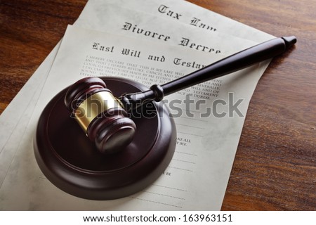 Gavel and legal papers last will and testament, divorce decree and tax law concept for the judicial system