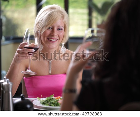 Friends enjoying a meal and cheerful discussion at a restaurant