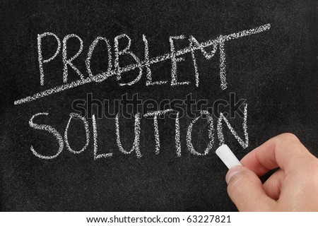 Crossing out the word problem and writing solution on blackboard