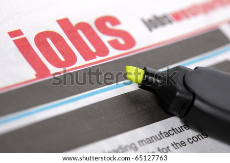 Job listing pages of a newspaper with highlighter pen