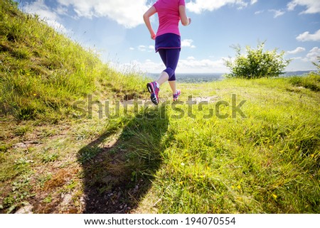 Outdoor cross-country running in early sunrise concept for exercising, fitness and healthy lifestyle