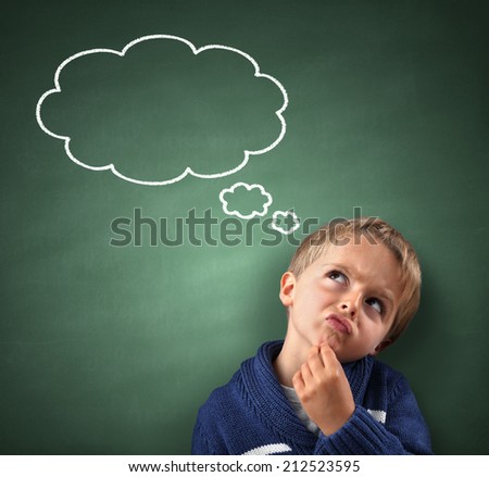 Child thinking with a thought bubble on the blackboard concept for confusion, inspiration and solution