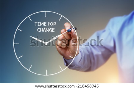 Businessman hand drawing a clock on whiteboard with time for change concept for planning, improvement and progress