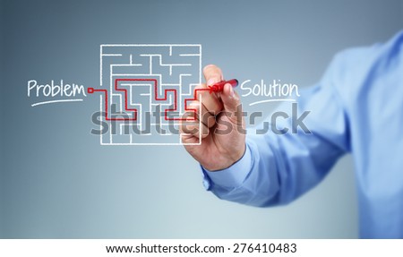 Business strategy businessman planning and finding a solution through a drawing of a labyrinth maze