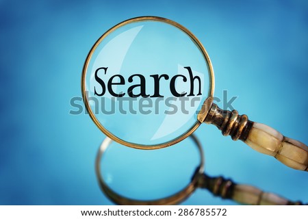 Magnifying glass focus on the word search concept for searching the internet, examination and exploration