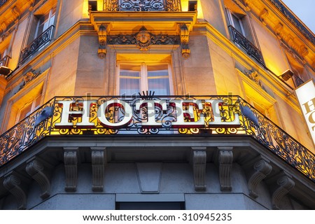 Illuminated hotel sign taken in Paris at night