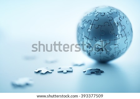 Global strategy solution concept - earth jigsaw puzzle