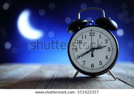 Alarm clock in the middle of the night insomnia or dreaming