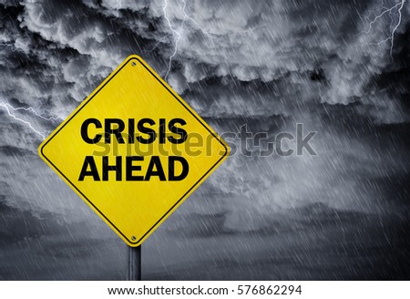 Crisis ahead sign in a rain storm concept for financial problems, risk and economic depression