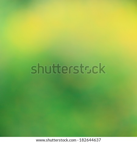 Green and yellow bush background. This is green bush and flower that is blured by camera.