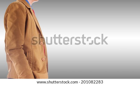 Side view of young man in brown fashion suit