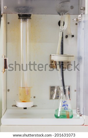 Group of laboratory flasks filled with a clear color liquid in  laboratory