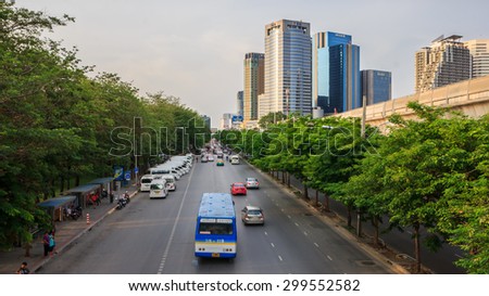 Bangkok, Thailand - May 10, 2015: Cars, buses, taxis and people crowd on street at Chatuchak park, famous and celebrated public park in Bangkok Thailand.