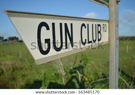 road sign for gun club