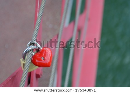 love heart locket closed onto another locket on a wire