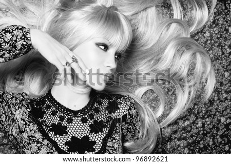 Black and white photo of  beautiful woman with magnificent hair