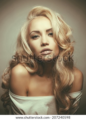 Photo of beautiful woman with magnificent blond hair. Hair Extension, Permed Hair