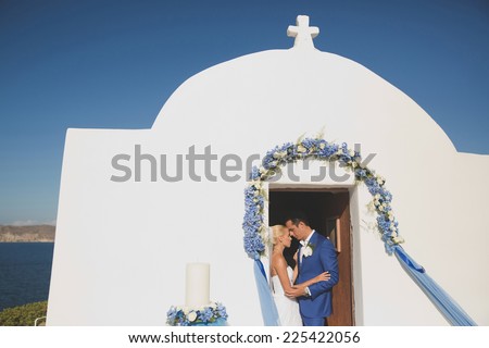 Art photo of the bride and groom in church door. Fashion wedding