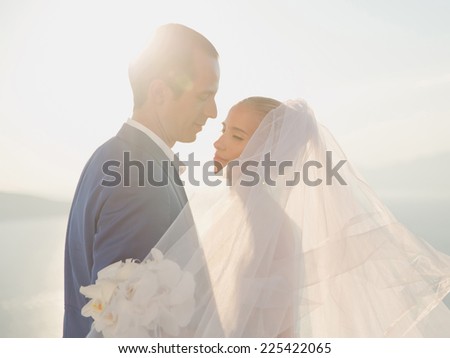 Art photo of bride and groom on the seashore. Fashion wedding
