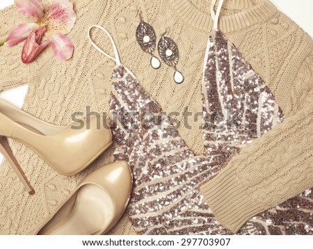 Stylish woman outfit in beige colors on white background