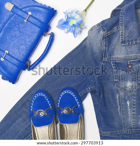 Stylish woman outfit in blue colors on white background