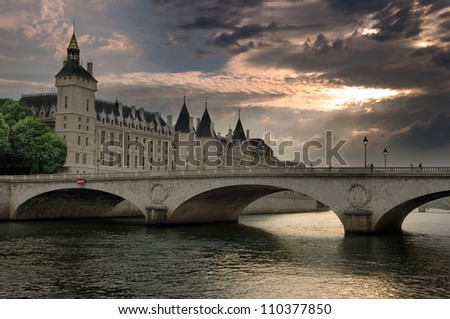 The Pont au Change, bridge over the Seine River and the Conciergerie, a former royal palace and prison in Paris, France.