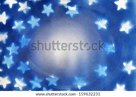 A painted swirl with white star silhouettes create a frame for a background or texture with lots of detail and texture.