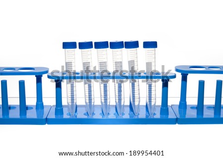 Empty Test Tubes in a Rack. Test tubes in test tube holders against a white background.