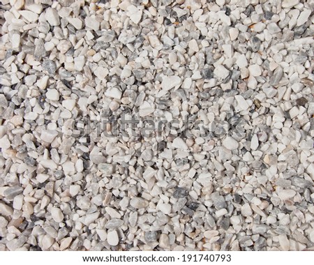 A flat background of broken white marble pebbles for background or texture.