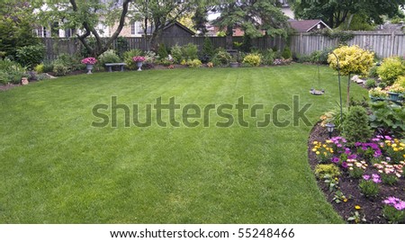 Landscaped Backyard Surrounded By Wooden Fence Stock Photo 55248466