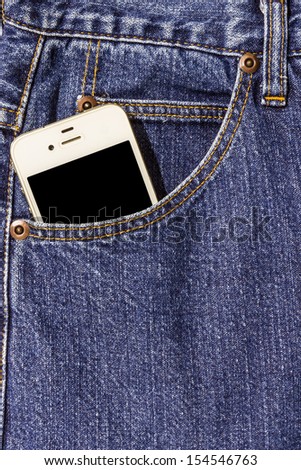 Blue jeans pocket with a mobile phone