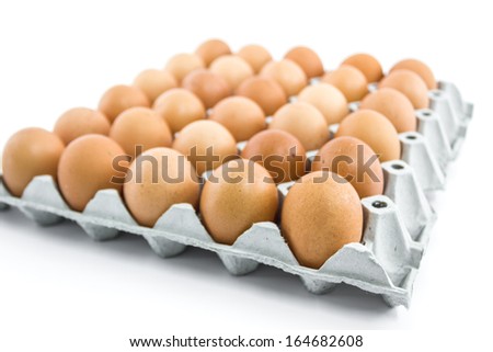 Eggs in the  paper tray package isolated on white background.