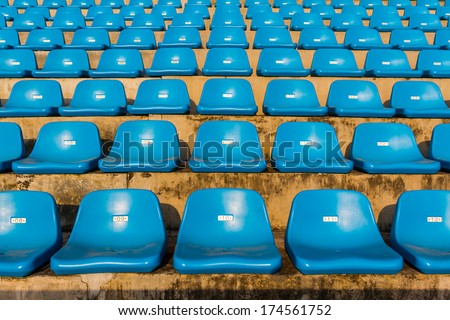 The empty blue stadium seat for watch some sport or football.