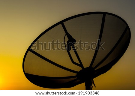 Satellite dish on sunset sky background communication technology network.
